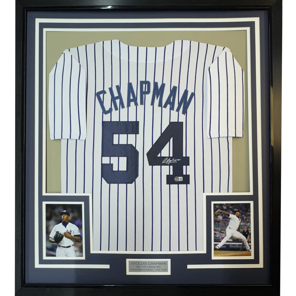 Framed signed New York Yankees Aroldis Chapman #54 jersey with player photos for display