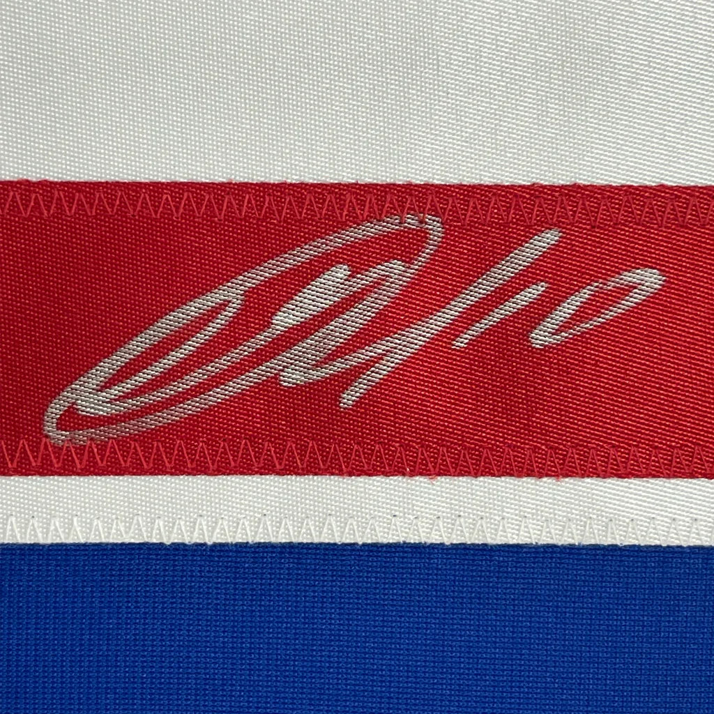 Red white and blue fabric with silver embroidery on Autographed New York Rangers Jersey