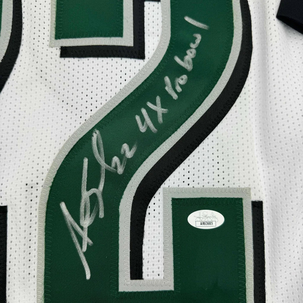 Autographed Philadelphia Eagles jersey with player photos and certification sticker