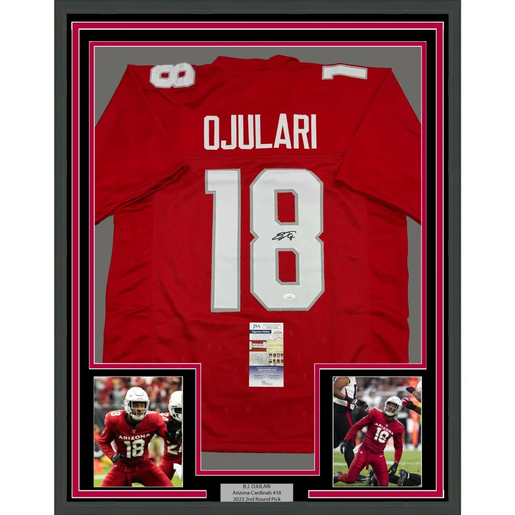 Signed OJULARI football jersey with action shots and authentication, red framed display