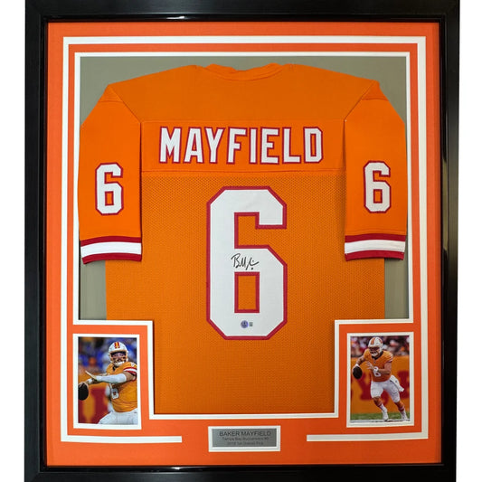 Framed autographed orange clemson tigers football jersey with white and red number 6 signed by Baker Mayfield