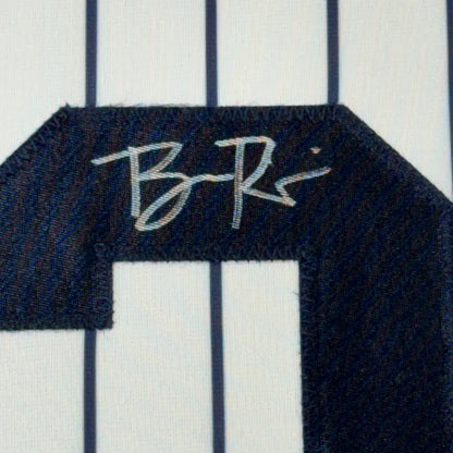 Navy blue embroidered number 1 patch with white signature on framed autographed ben rice new york pinstripe jersey back