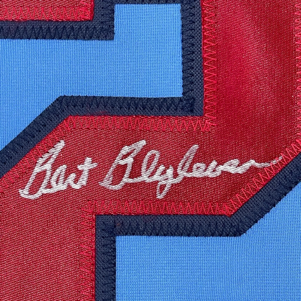 Blue and red sports jersey with embroidered signature ready for display