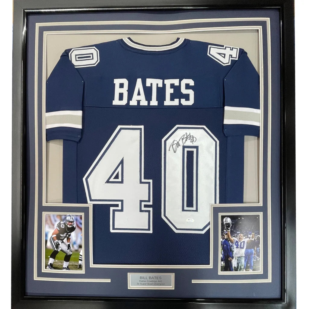 Back of a framed autographed navy blue Dallas Cowboys football jersey with white Bates 40 lettering signed by Bill Bates