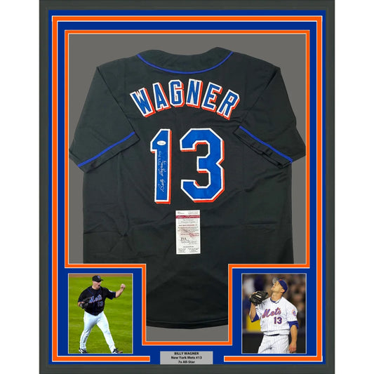 Framed autographed black baseball jersey with player photos for display