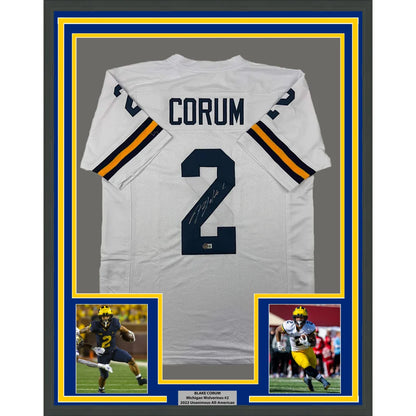 Framed Autographed Blake Corum 35x39 Michigan White College Football Jersey Beckett BAS COA | Hall of Fame Sports Memorabilia | vintageantiquesgifts.com