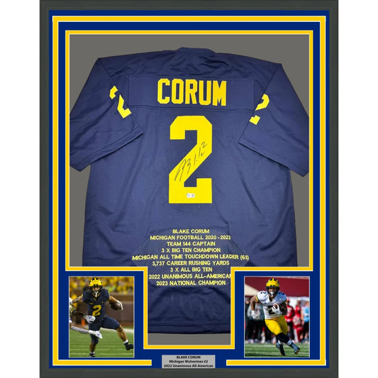 Framed Autographed Blake Corum Michigan 35x39 Blue Stat College Football Jersey Beckett BAS COA | Hall of Fame Sports Memorabilia | vintageantiquesgifts.com