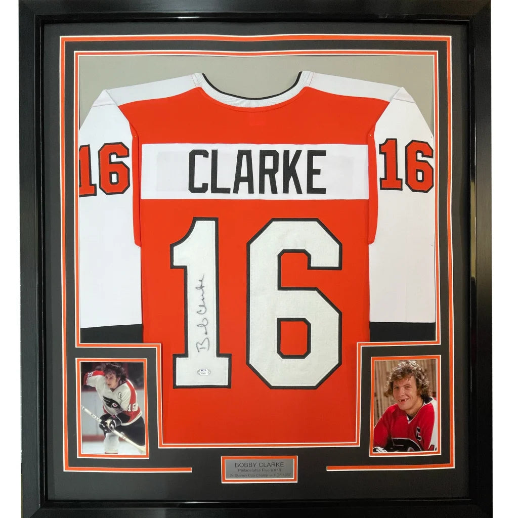 Framed Bob Clarke signed hockey jersey with autograph and photos display