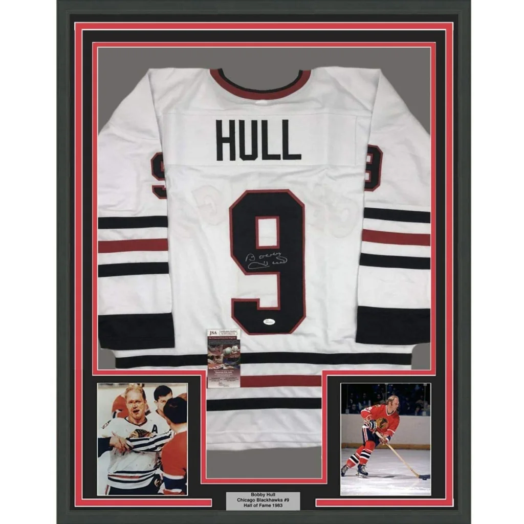 Professionally framed Bobby Hull Chicago White hockey jersey with autographs and photos for man cave
