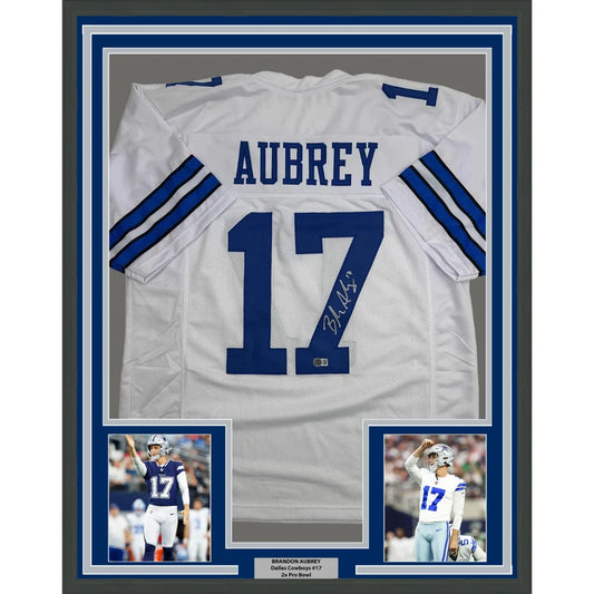 Framed Autographed Brandon Aubrey 35x39 Dallas White Football Jersey Beckett BAS COA | Hall of Fame Sports Memorabilia | vintageantiquesgifts.com