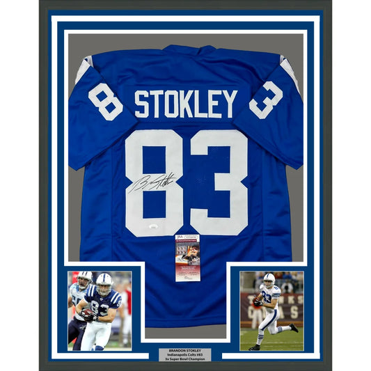 Framed autographed blue NFL jersey with player photos and commemorative plaque for display