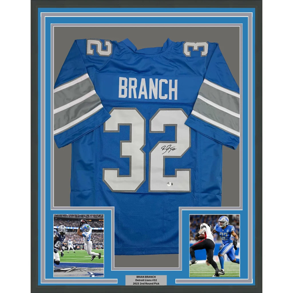 Back of framed autographed Brian Branch Detroit Lions blue jersey with name Branch number 32 white silver lettering Beckett BAS COA