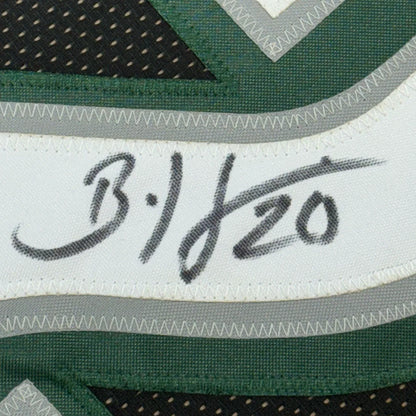 Autographed Green and White Eagles Jersey displayed in Brian Dawkins Signed Jersey masterpiece