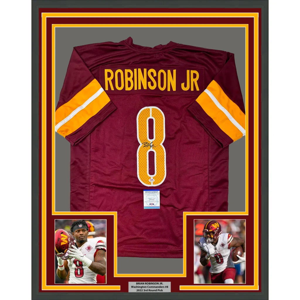 Framed Brian Robinson Jr. Washington Commanders autographed jersey with player photos