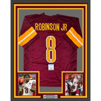 Framed Brian Robinson Jr. Washington Commanders autographed jersey with player photos
