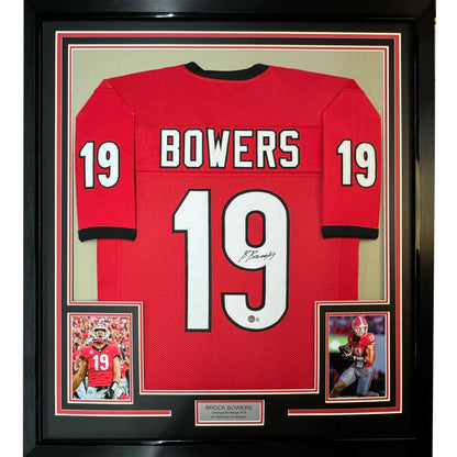 Framed autographed red Georgia Bulldogs football jersey with white number 19 and name Bowers displayed in black shadowbox
