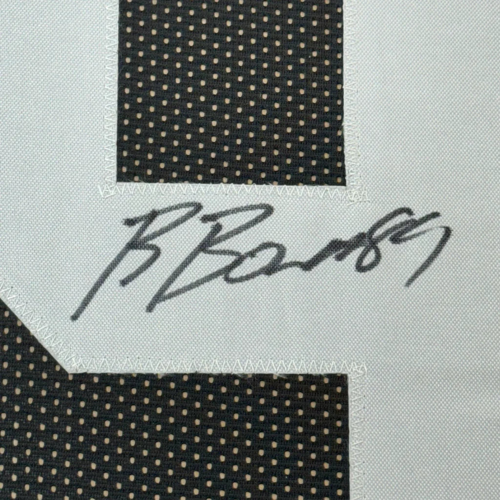 Black and white polka dot fabric with dark grey signature for Museum Quality Framed Football Jersey