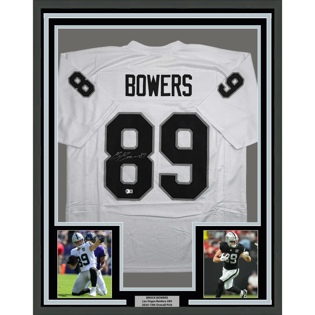 Framed autographed Brock Bowers white Raiders jersey back with number 89, Beckett COA