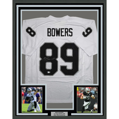Framed autographed Brock Bowers white Raiders jersey back with number 89, Beckett COA