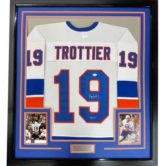 Framed Autographed Bryan Trottier HOF 97 35x39 New York White Hockey Jersey JSA COA | Hall of Fame Sports Memorabilia | vintageantiquesgifts.com