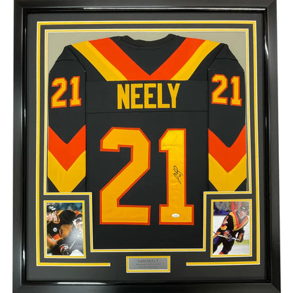 Autographed Cam Neely black, orange, yellow hockey jersey with action photos and nameplate