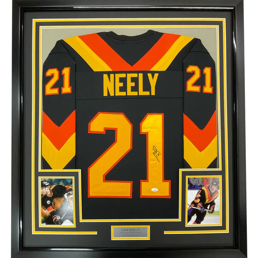 Autographed Cam Neely black, orange, yellow hockey jersey with action photos and nameplate