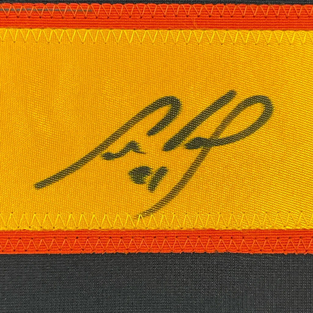 Yellow fabric with black embroidered signature and orange trim from Cam Neely Jersey Display