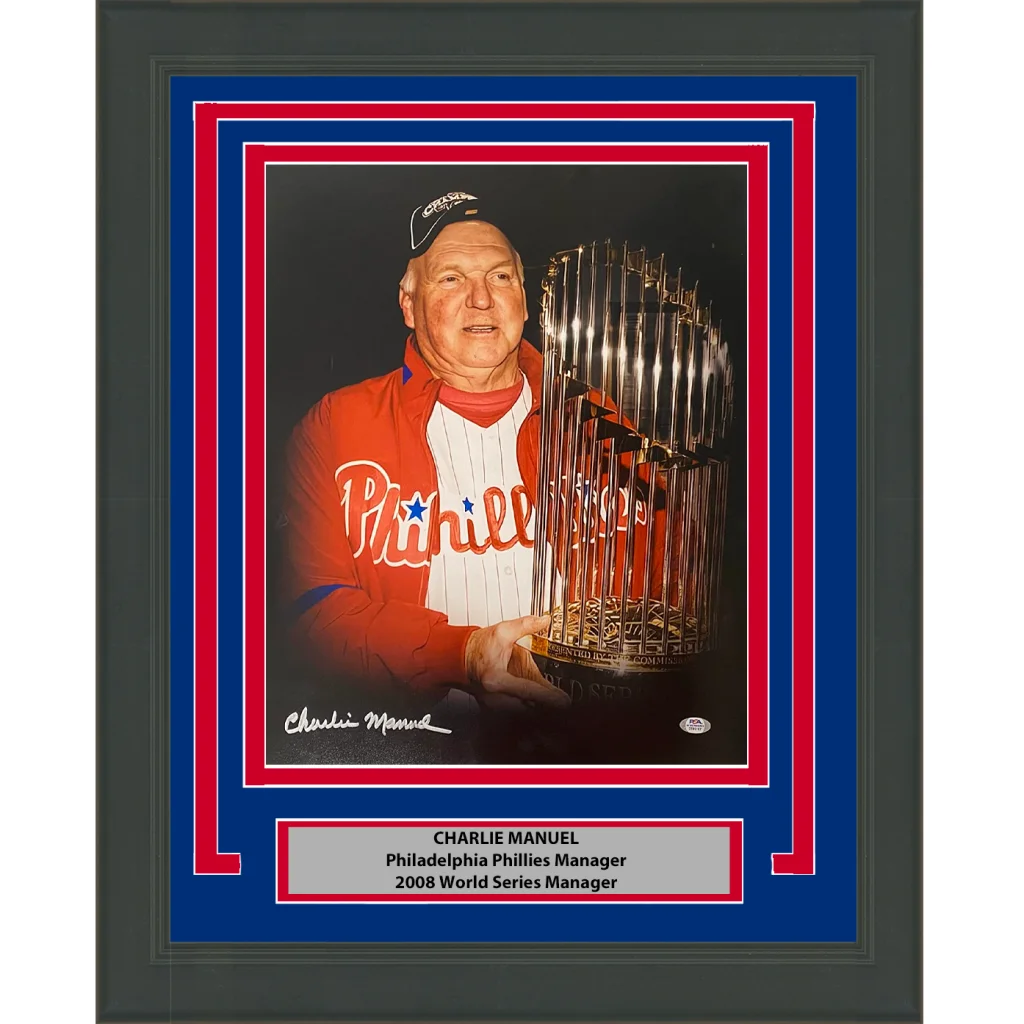 Framed photo of Charlie Manuel holding a trophy ready to hang for fans