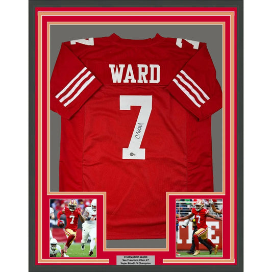 Framed autographed red San Francisco 49ers football jersey with white lettering signed by Charvarius Ward showing back side