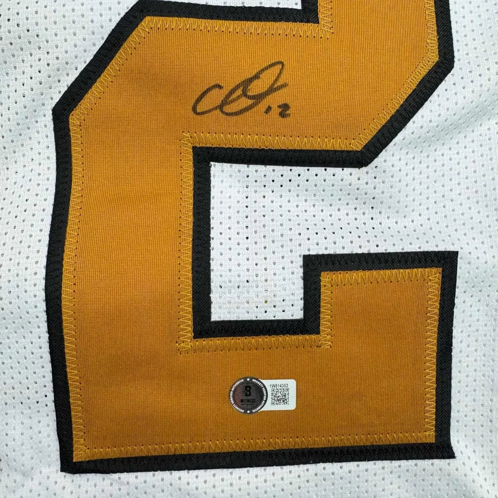 Framed autographed Chris Olave New Orleans white Color Rush jersey back with gold C