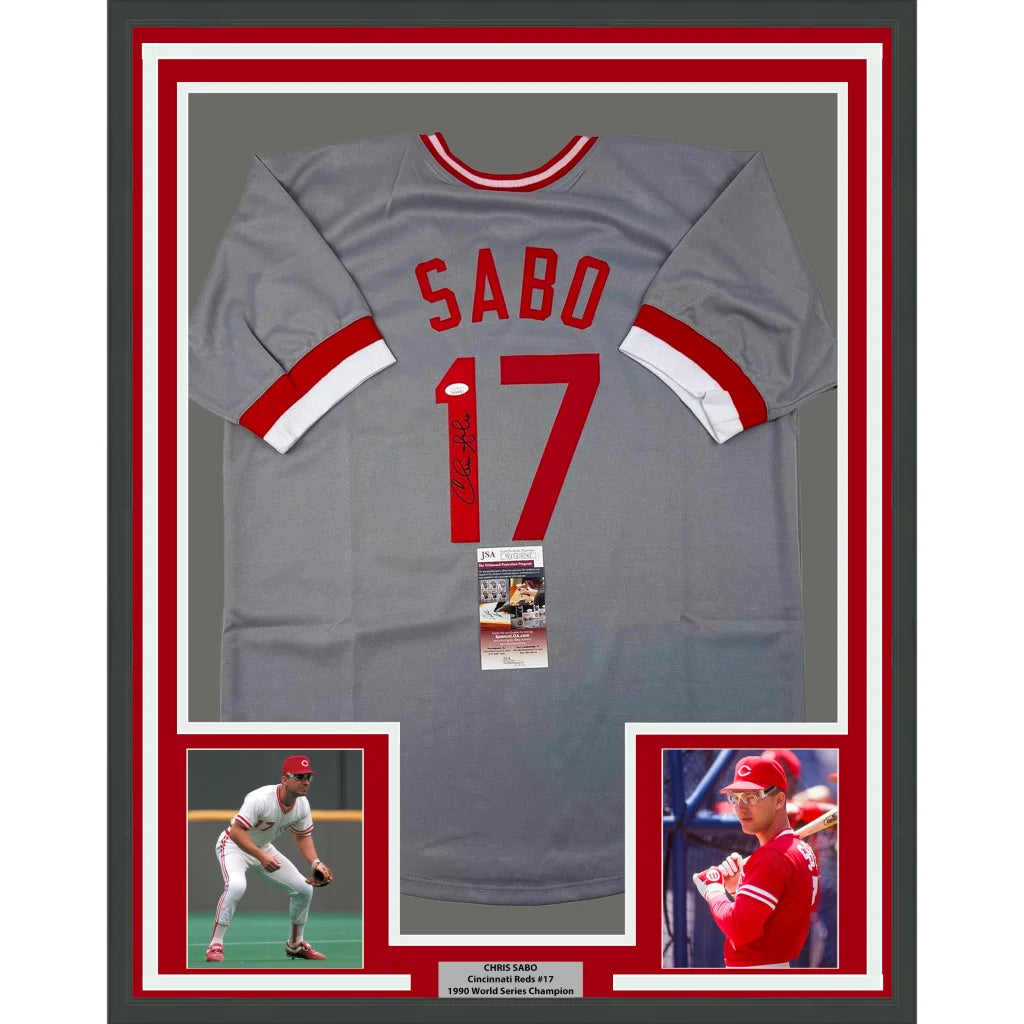 Framed gray baseball jersey with red lettering and white trim.