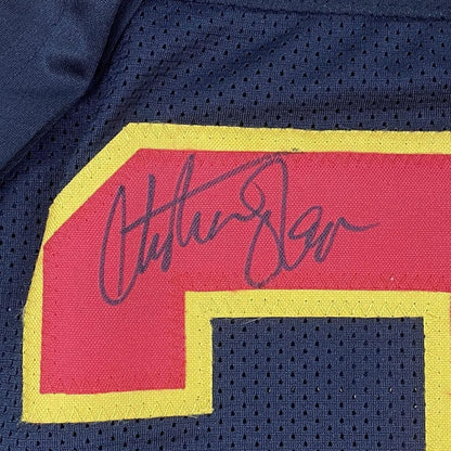 Autographed Christian Okoye Chiefs jersey with Hall of Fame plaque on display