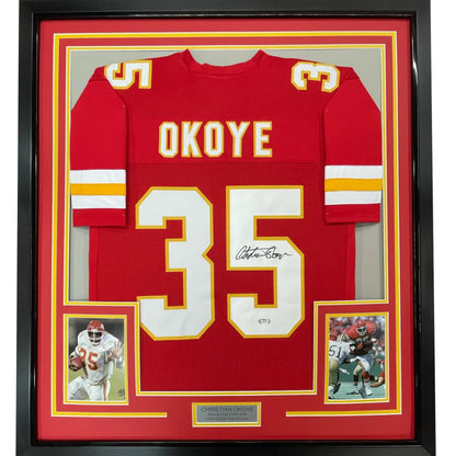Framed autographed red Kansas City Chiefs jersey number 35 by Christian Okoye with JSA COA