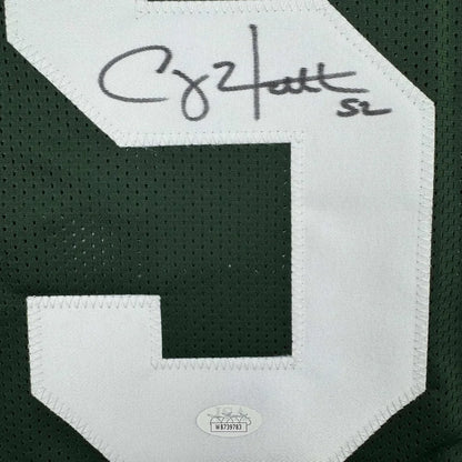 Green and white Packers jersey with number 9 for man cave