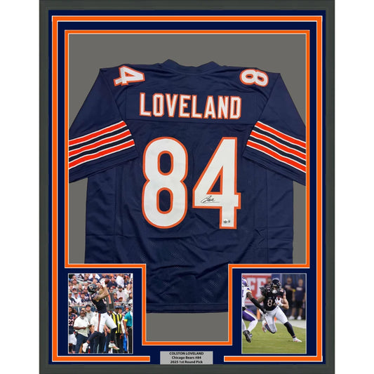 Navy blue and orange chicago bears jersey with the name ’loveland’ and number 84, featuring a signature below the number.