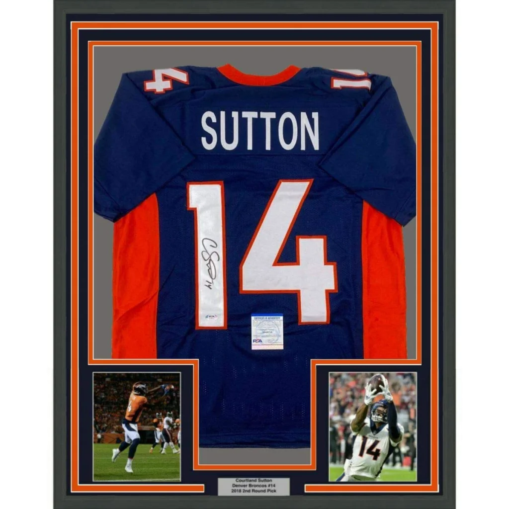 Framed autographed denver broncos blue and orange football jersey with white number 14 and name sutton in black frame