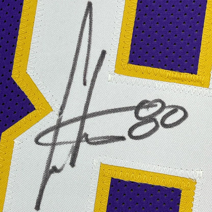 Framed autographed Cris Carter Minnesota Vikings purple jersey with JSA COA