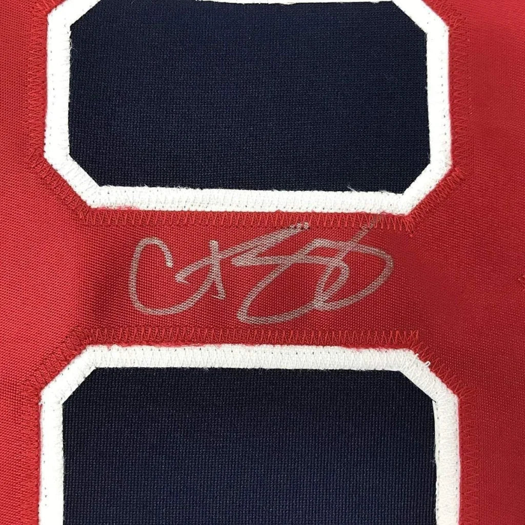Autographed red Sox jersey with navy and white numbers in museum quality display