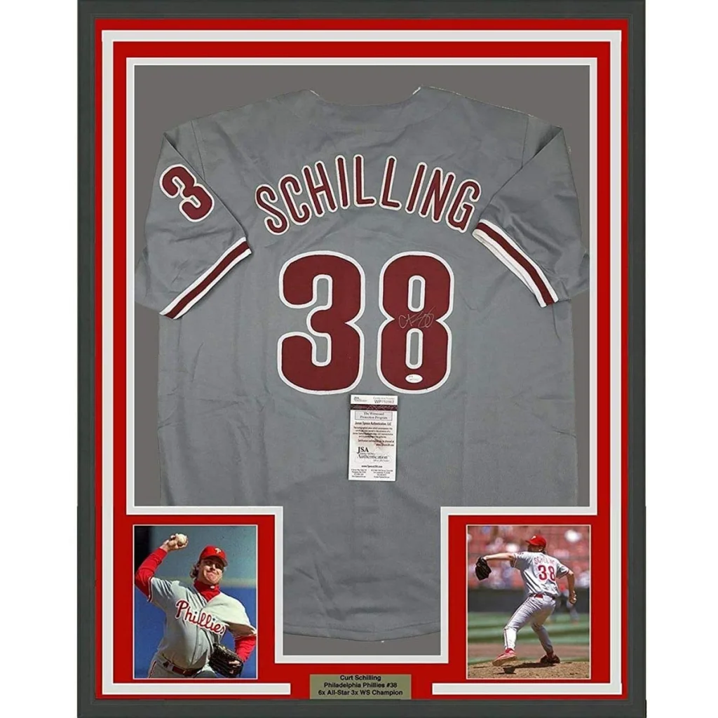 Signed Curt Schilling Phillies jersey with photos and plaque, perfect for fans and collectors