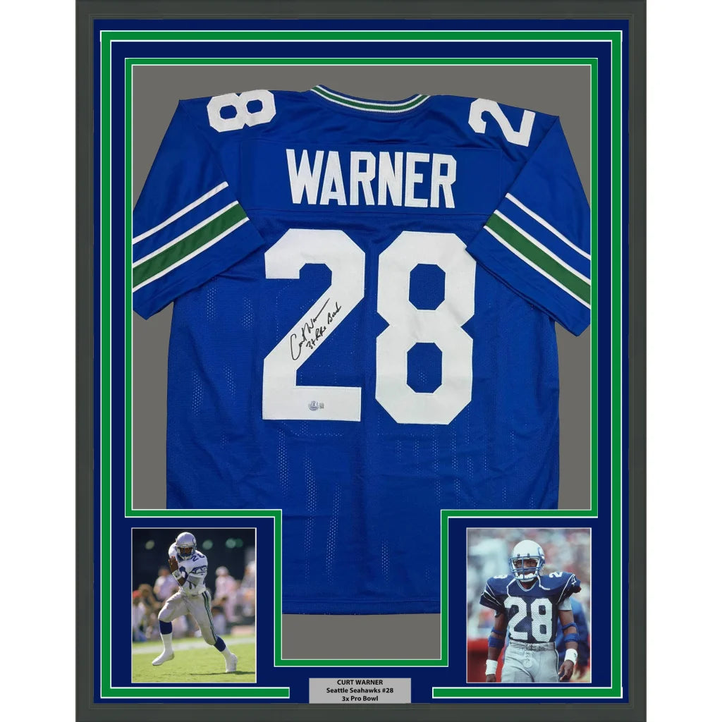 Framed autographed Curt Warner Seattle Seahawks blue retro jersey back, number 28