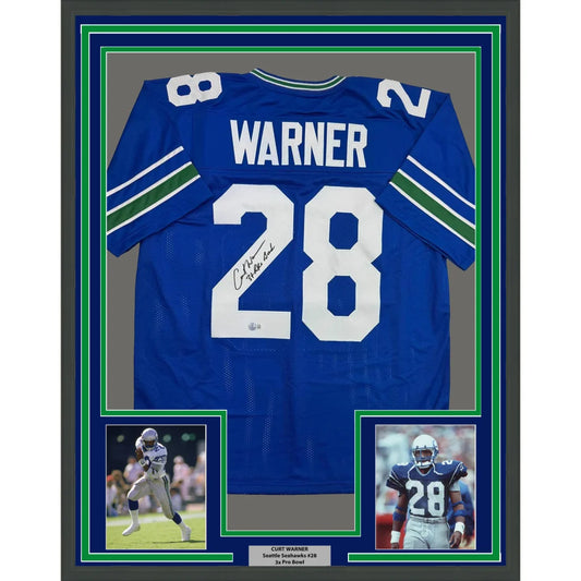 Framed Autographed Curt Warner 35x39 3x Pro Bowl Seattle Blue Retro Football Jersey Beckett BAS COA | Hall of Fame Sports Memorabilia | vintageantiquesgifts.com