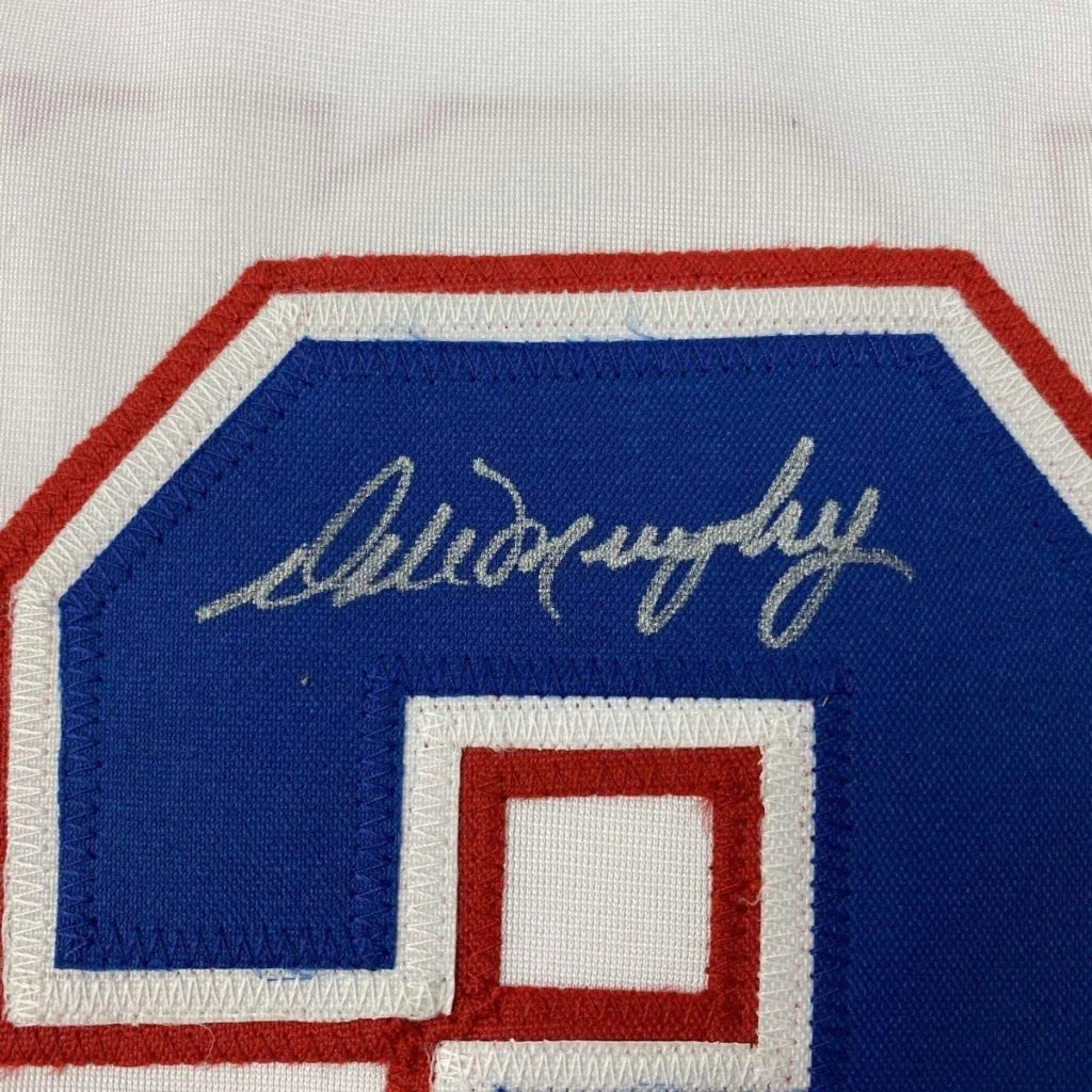 Blue and red embroidered number patch with Alain Morin silver signature on Dale Murphy framed Atlanta jersey