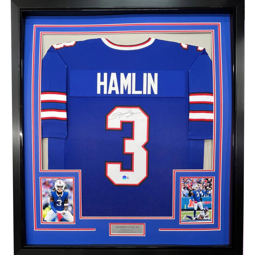 Framed Damar Hamlin signed Buffalo Bills jersey with photos on display