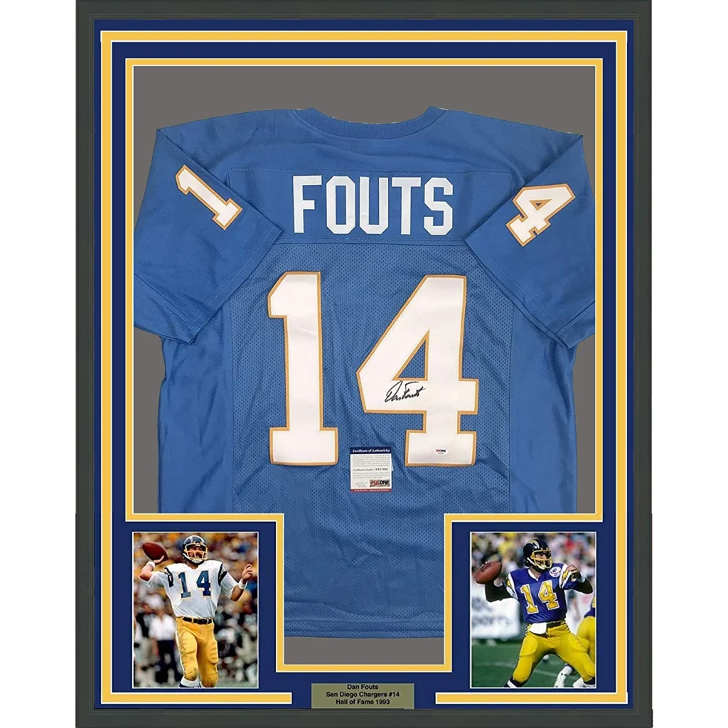 Back of a framed autographed san diego chargers powder blue football jersey with white and gold lettering
