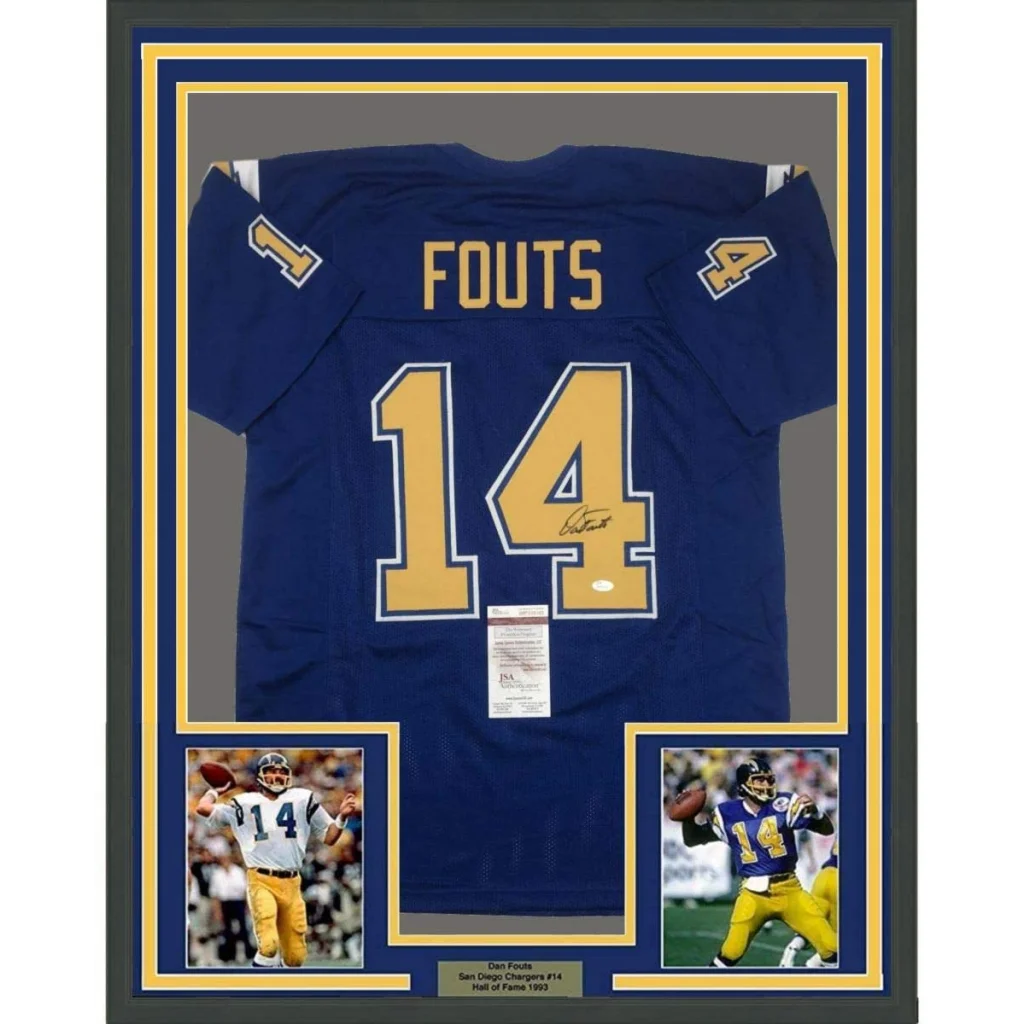 Back side of a framed autographed san diego chargers royal blue football jersey with gold lettering and signature