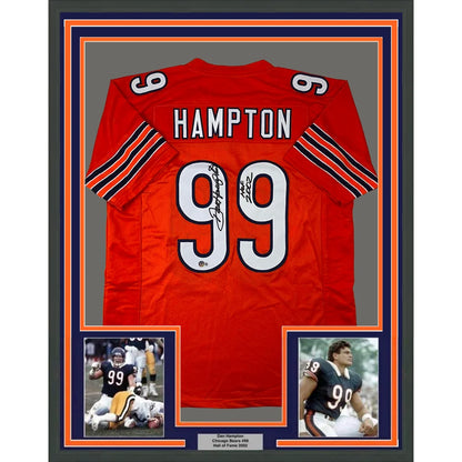Back of a framed autographed red Chicago Bears jersey with name Hampton number 99 black and orange sleeve stripes