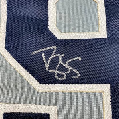 Dark blue and light gray Yankees jersey with autograph and framed photos