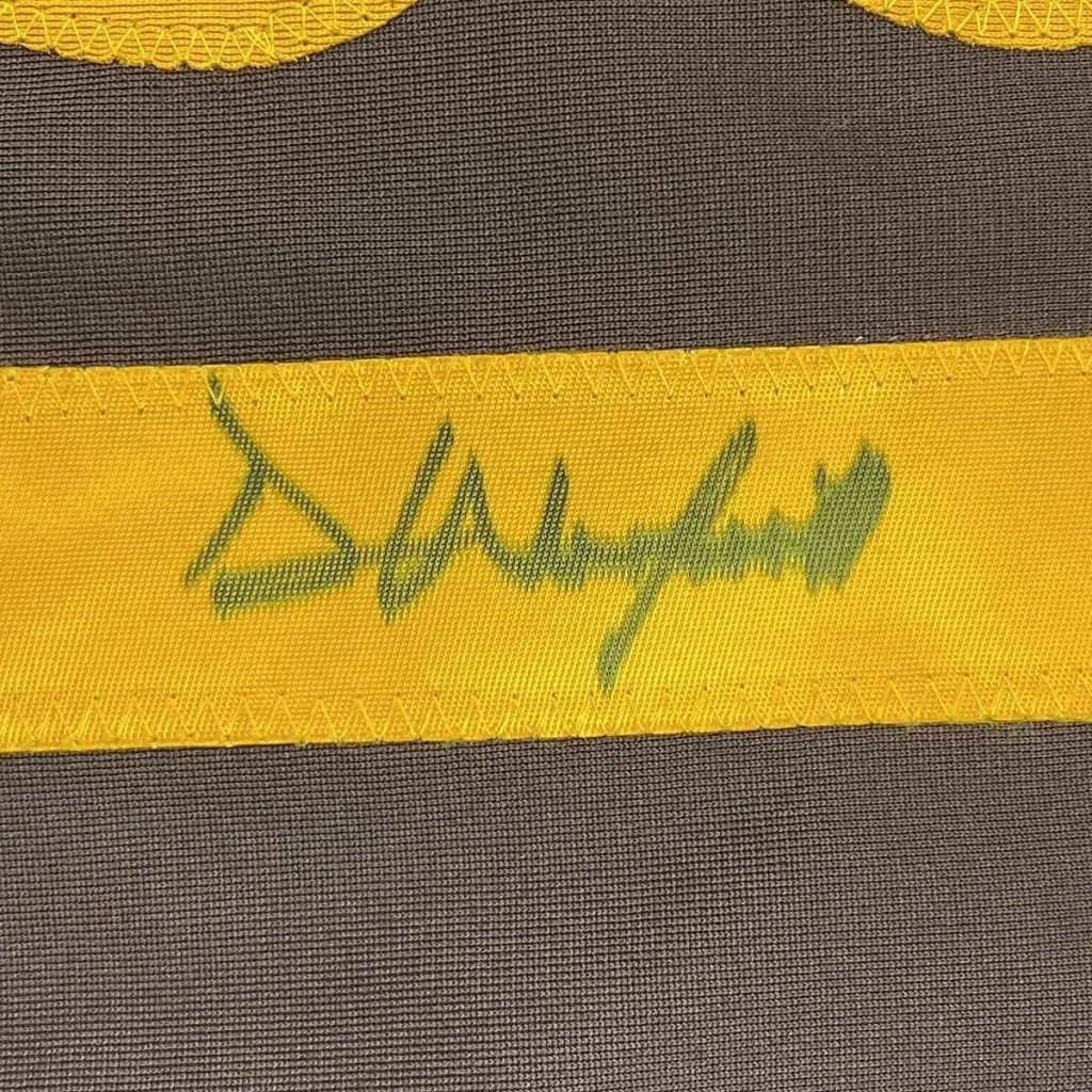Framed autographed Dave Winfield yellow fabric band with green signature