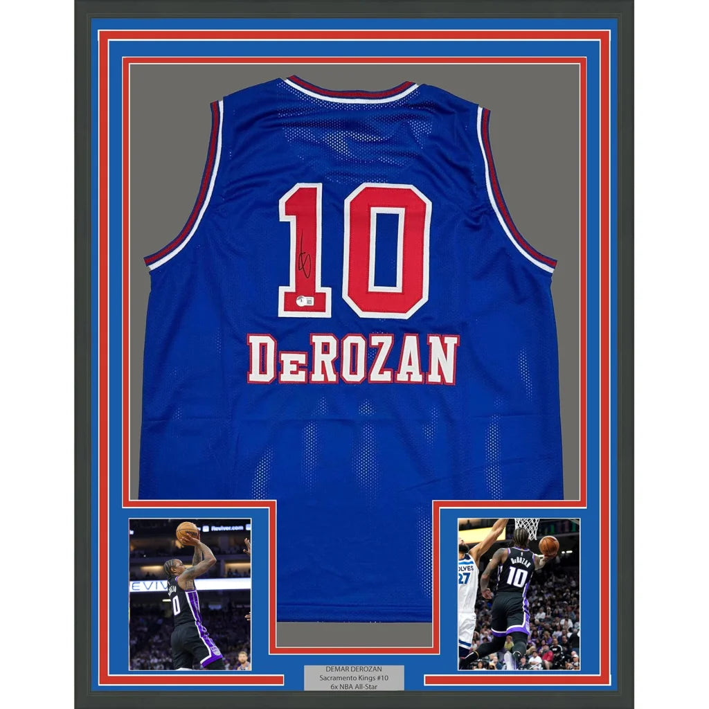 DeMar DeRozan autographed blue basketball jersey in man cave display with action photos