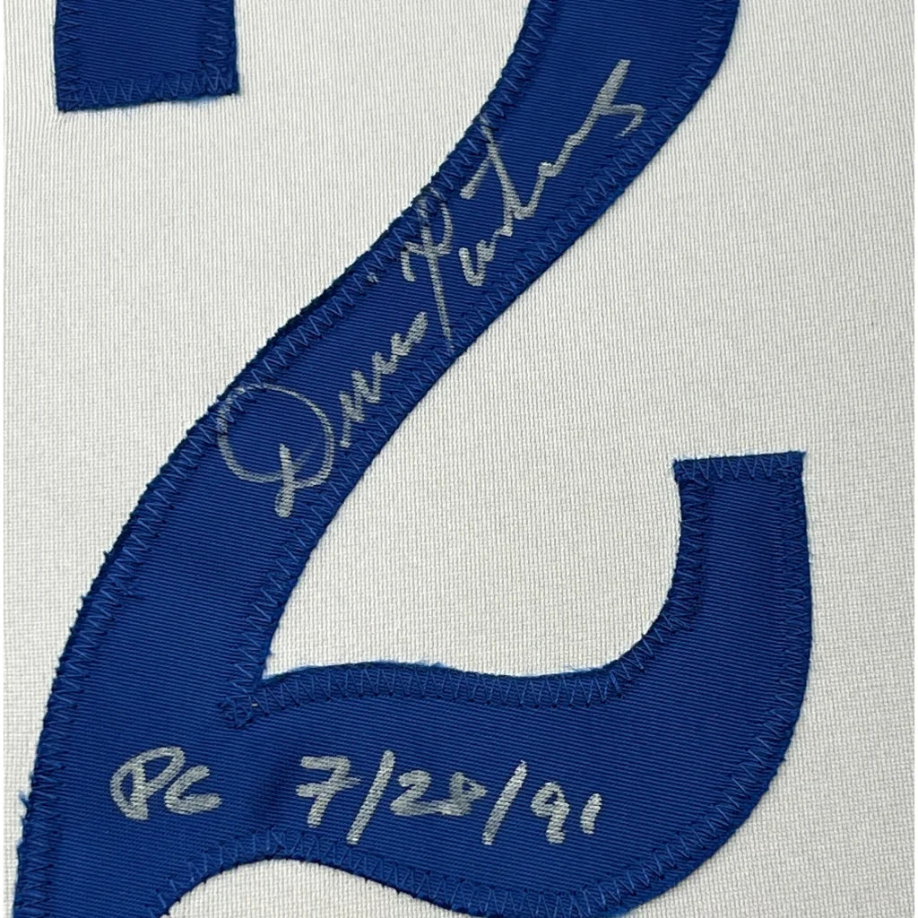 Framed autographed Dennis Martinez Montreal Expos jersey with blue number six patch